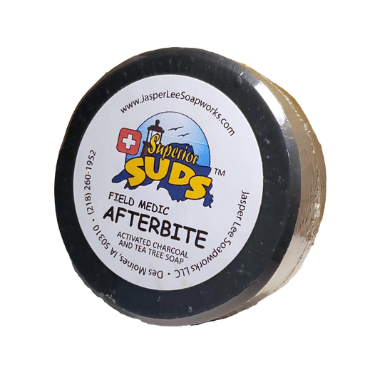 Field Medic Afterbite activated charcoal and tea tree bar in clear biodegradable packaging
