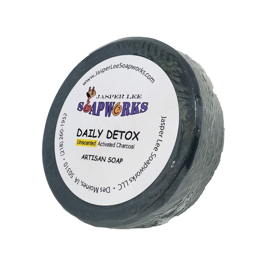 Unscented Daily Detox activated charcoal soap in biodegradable clear packaging